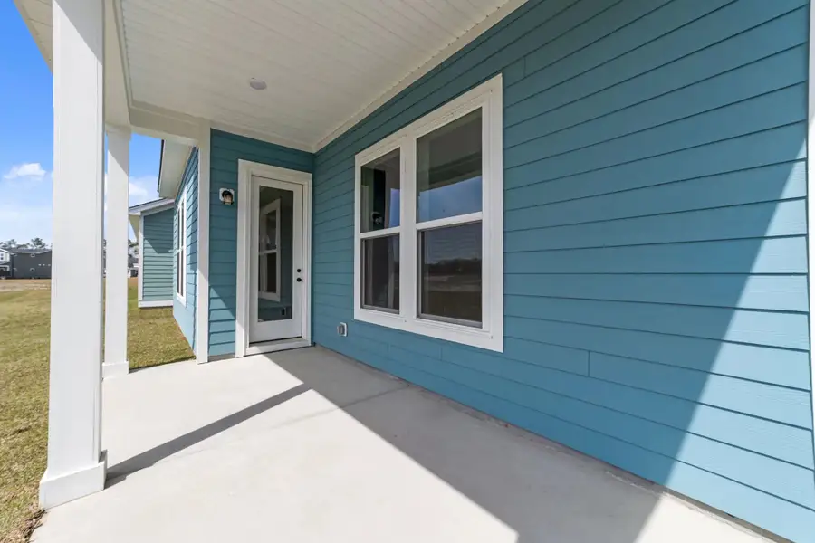 Exterior details and patio area of a home in Blue Heron Retreat, Little River (Image 4).