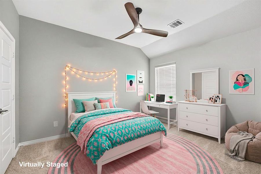 Bedroom featuring light carpet, vaulted ceiling, and a ceiling fan