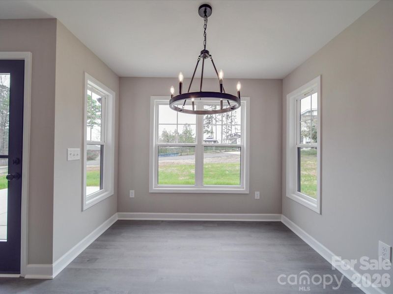 Dining area overlooking the fenced backyard.