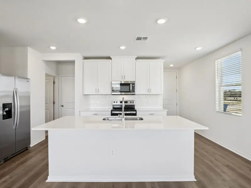 Furnished interior view inside a new home in The Reserve at Hammock Oaks Townes, Lady Lake (Image 3).