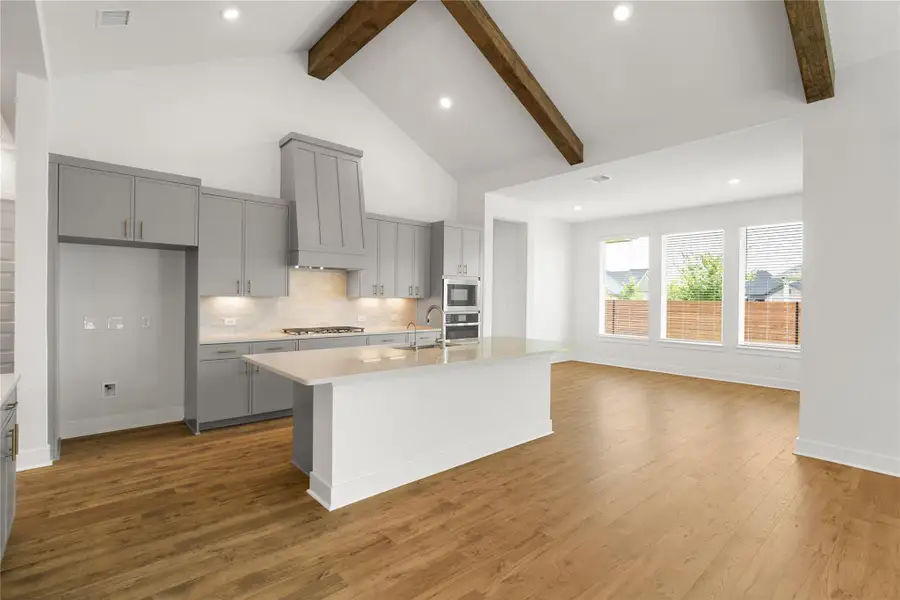Modern kitchen featuring a central island and sleek cabinetry. Modern kitchen featuring a central island and sleek cabinetry.