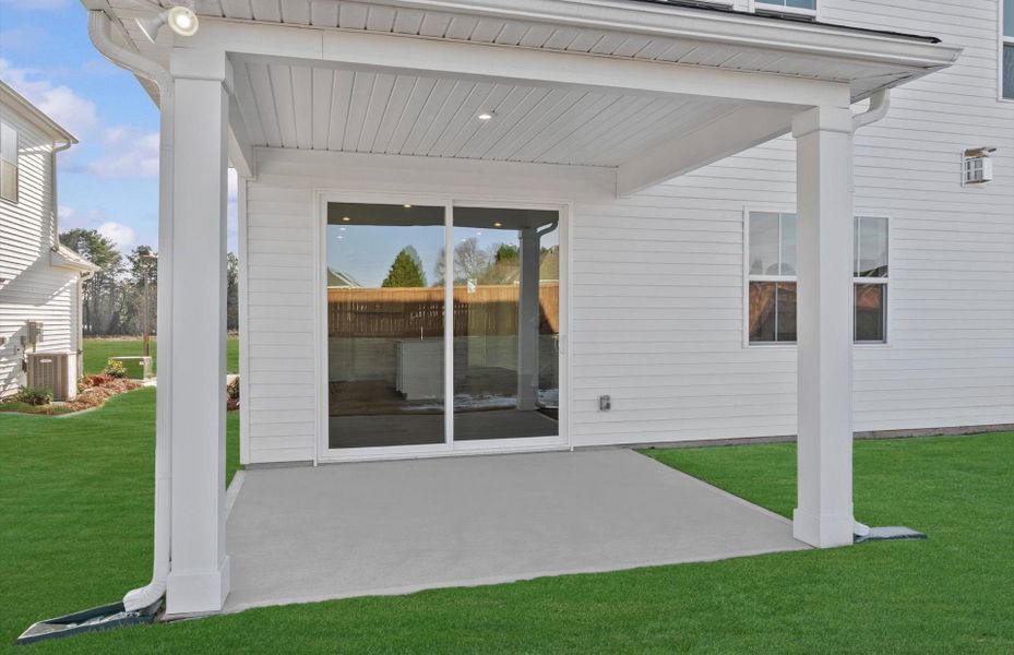 Exterior details and patio area of a home in Fox Hollow, Spartanburg (Image 21).