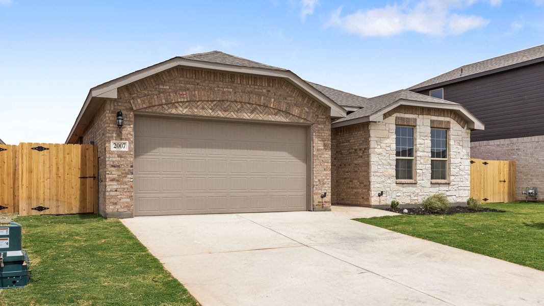 Representative exterior photo of a completed home built from the THE HOBBS by D.R. Horton in Northwest Passage, Midland, TX (Image 19). Representative exterior photo of a completed home built from the THE HOBBS by D.R. Horton in Northwest Passage, Midland, TX (Image 19).