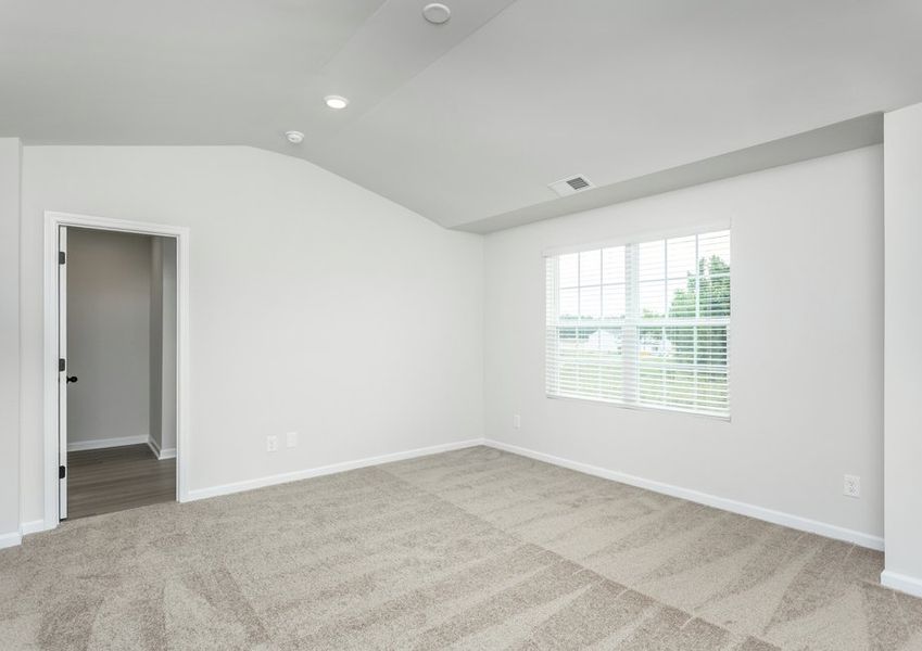 The master bedroom has cathedral ceilings.
