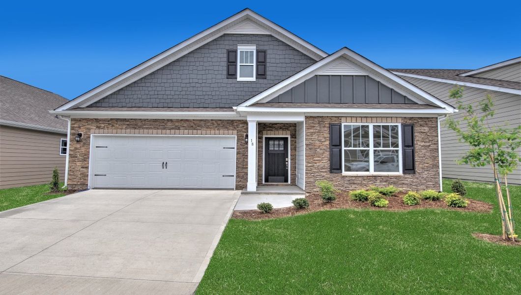 Front exterior of a new home in Reserve at Tap Root Farms, Fletcher, NC, highlighting curb appeal (Image 1). Front exterior of a new home in Reserve at Tap Root Farms, Fletcher, NC, highlighting curb appeal (Image 1).