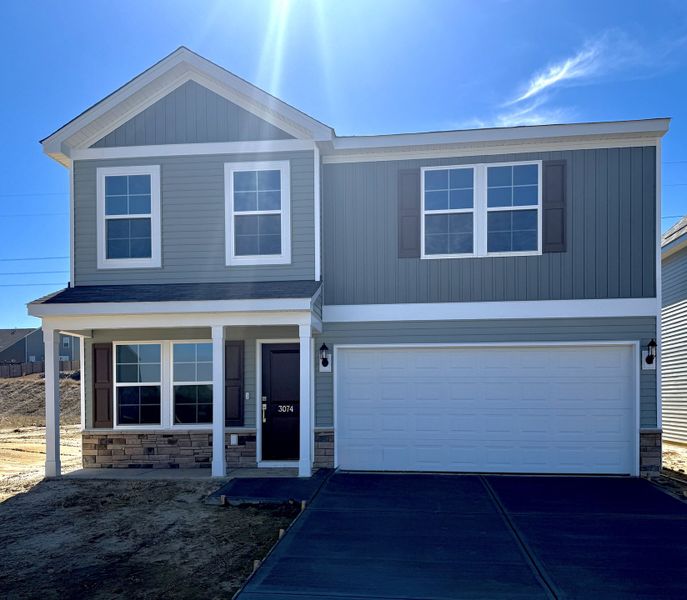 Front exterior of a new home in Ellington, Elgin, SC, highlighting curb appeal (Image 1). Front exterior of a new home in Ellington, Elgin, SC, highlighting curb appeal (Image 1).