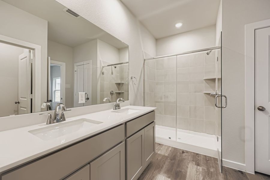 A bathroom with a glass shower.
