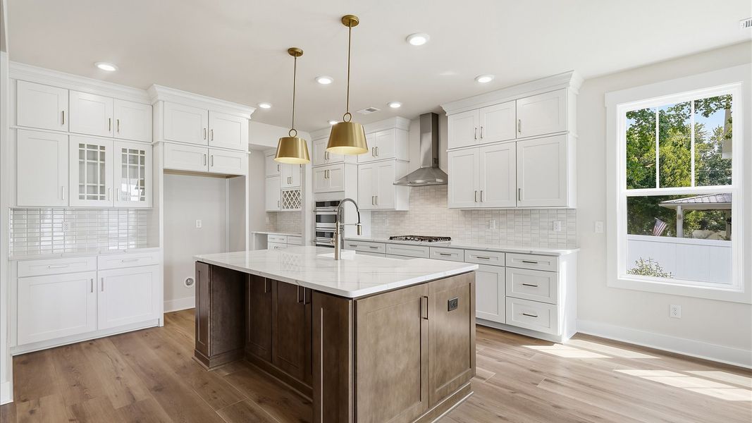 Notable 9-foot island provides generous prep and gathering space in this thoughtfully designed kitchen