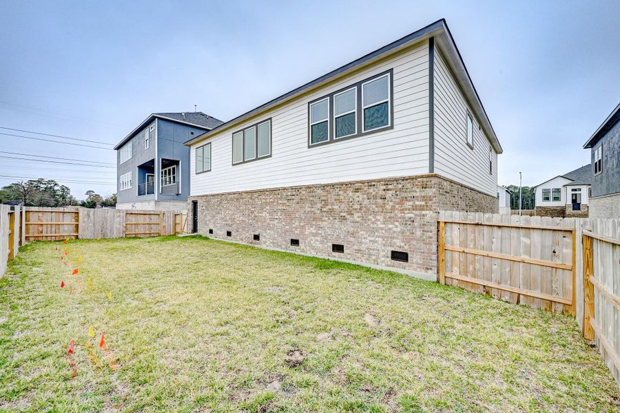 Exterior details and patio area of a home in Townsen Landing, Humble (Image 26).
