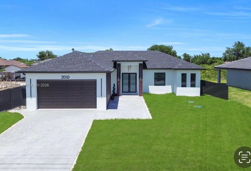 Front exterior of a new home in , Lehigh Acres, FL, highlighting curb appeal (Image 1). Front exterior of a new home in , Lehigh Acres, FL, highlighting curb appeal (Image 1).
