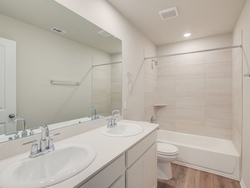 Furnished interior view inside a new home in Turner's Crossing - Reserve Collection, Buda (Image 6).