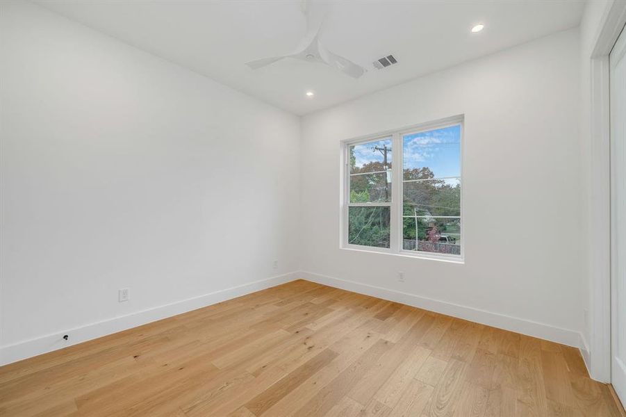 Empty room featuring light wood finished floors, recessed lighting, and ceiling fan Empty room featuring light wood finished floors, recessed lighting, and ceiling fan