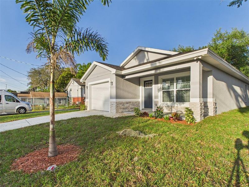 Front exterior of a new home in , Lakeland, FL, highlighting curb appeal (Image 15).
