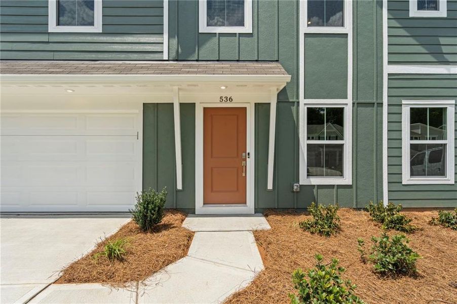 Front exterior of a new home in Crossvine Estates, Braselton, GA, highlighting curb appeal (Image 26).