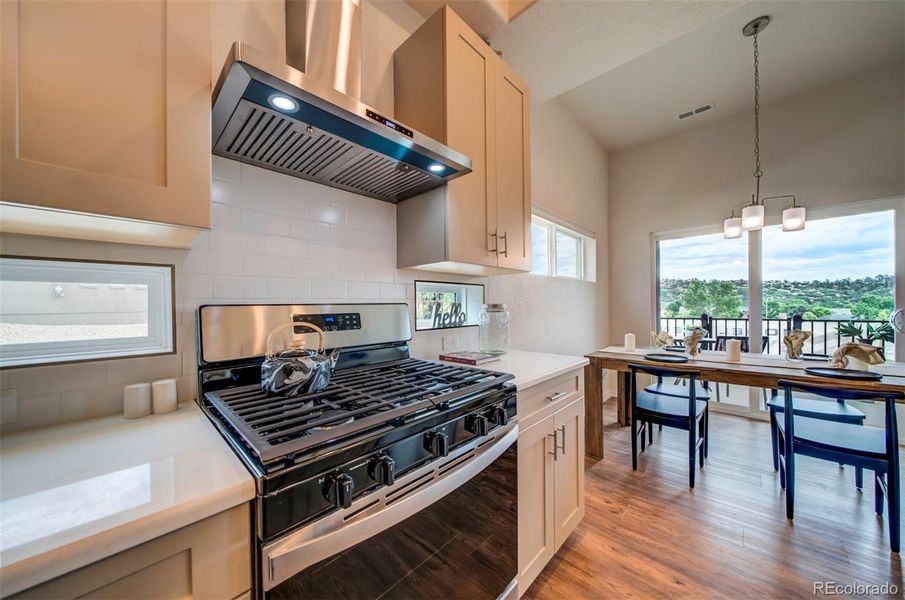 The kitchen is adjacent to the dining room.