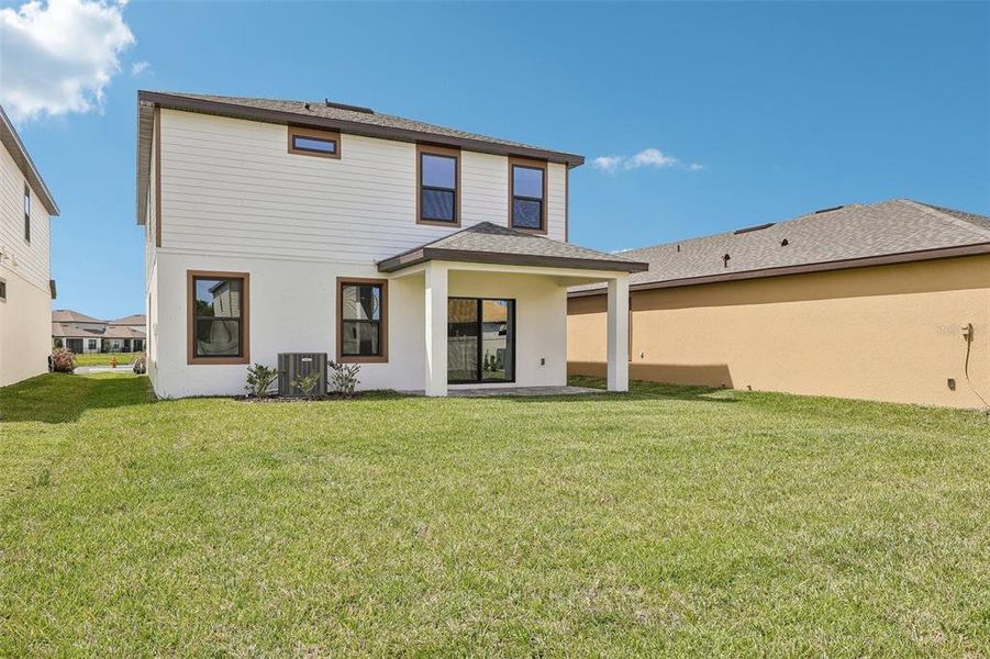Exterior details and patio area of a home in Grasslands West, Lakeland (Image 19).