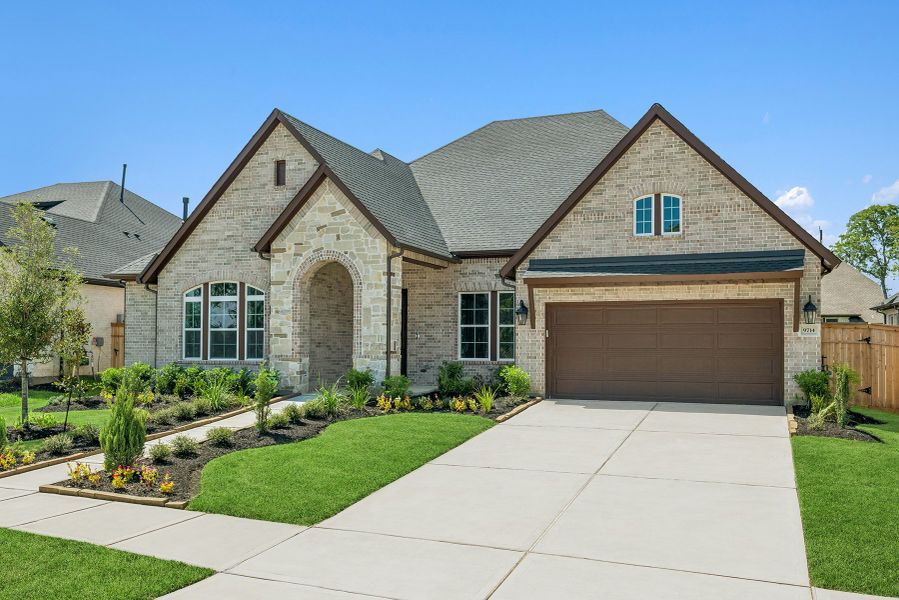Front exterior of a new home in Sienna 65' Homesites, Missouri City, TX, highlighting curb appeal (Image 22).