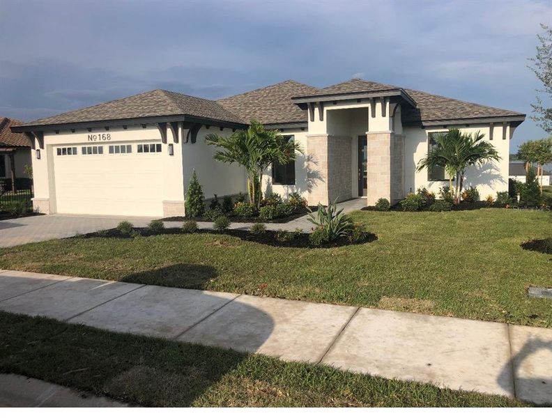 Front exterior of a new home in , Lake Alfred, FL, highlighting curb appeal (Image 14). Front exterior of a new home in , Lake Alfred, FL, highlighting curb appeal (Image 14).