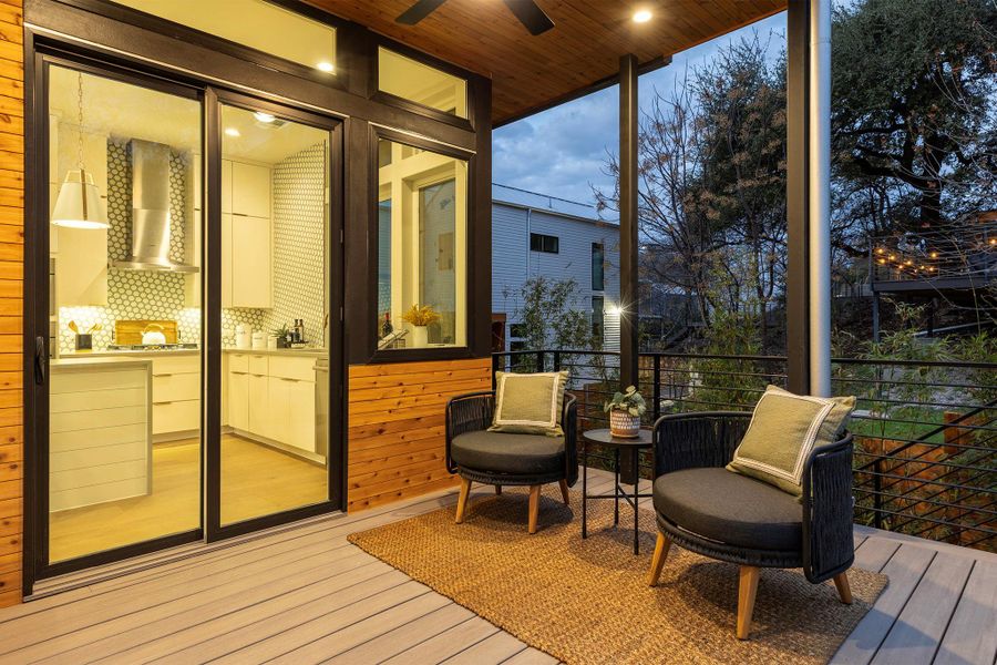 Sunroom / solarium featuring wood ceiling and ceiling fan