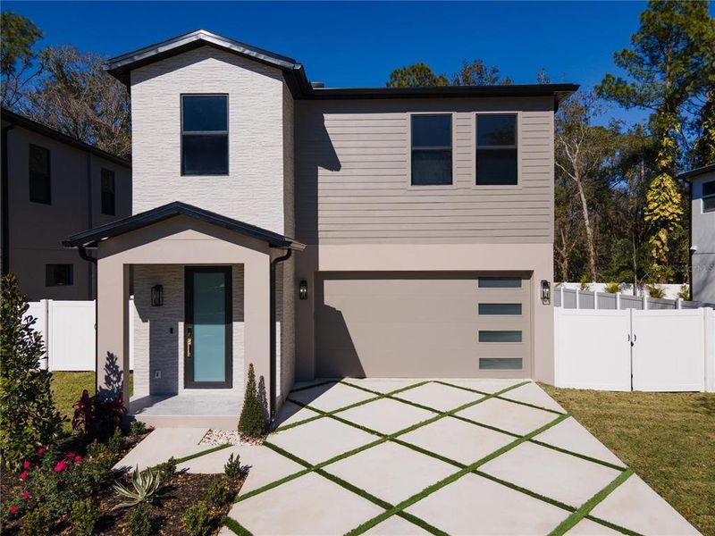 Front exterior of a new home in , Tampa, FL, highlighting curb appeal (Image 32).