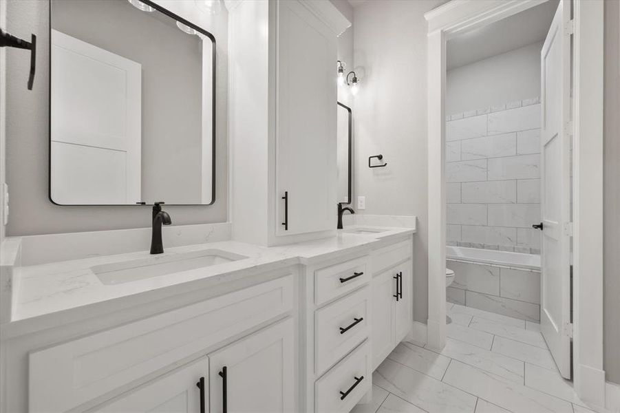 Dual vanity with integrated sinks and white countertops