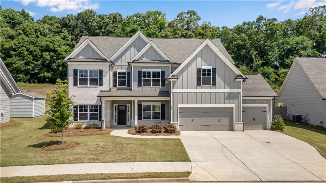 Front exterior of a new home in Hidden Fields, Hoschton, GA, highlighting curb appeal (Image 23).