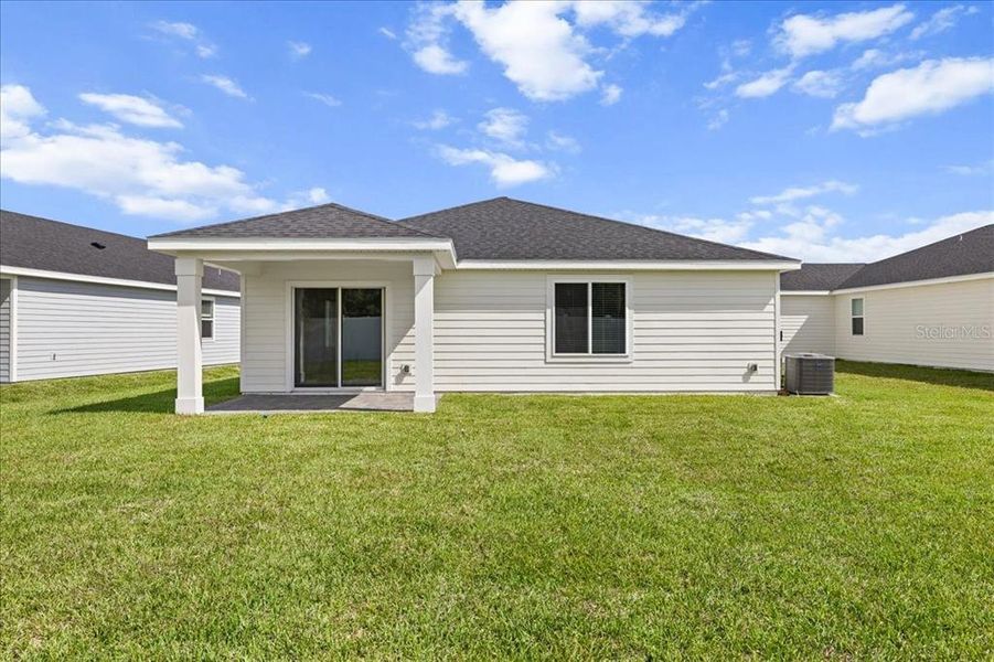 Exterior details and patio area of a home in Colbert Landings, Palm Coast (Image 25).