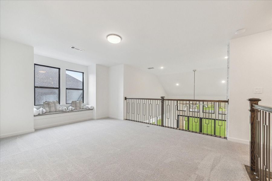 Upstaiirs is the Game Room with a set of double window seat and overlooks the lower level. Upstaiirs is the Game Room with a set of double window seat and overlooks the lower level.