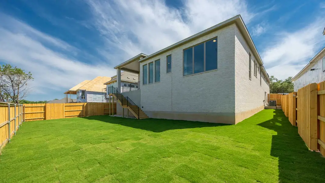 Exterior details and patio area of a home in Parkside On The River West 60', Georgetown (Image 2).