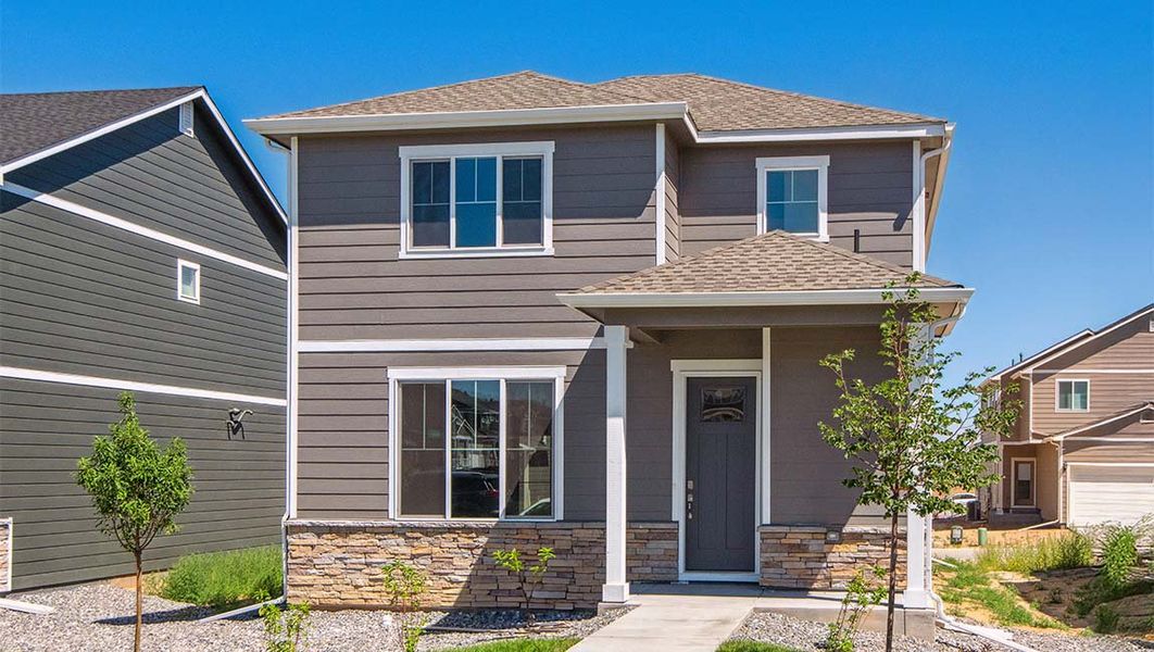 Representative exterior photo of a completed home built from the DOUGLAS by D.R. Horton in Horizon Uptown, Aurora, CO (Image 18).