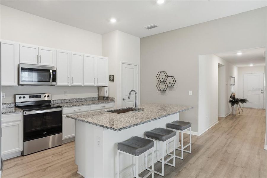 Furnished interior view inside a new home in Bellaviva I at Westside, Davenport (Image 16).