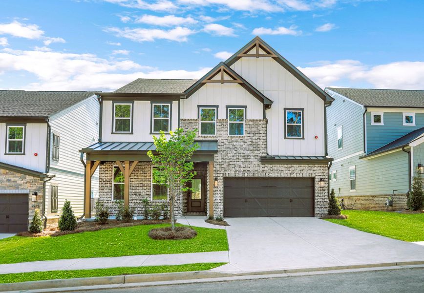 Front exterior of a new home in Wisteria at GreenHouse, Marietta, GA, highlighting curb appeal (Image 1). Front exterior of a new home in Wisteria at GreenHouse, Marietta, GA, highlighting curb appeal (Image 1).
