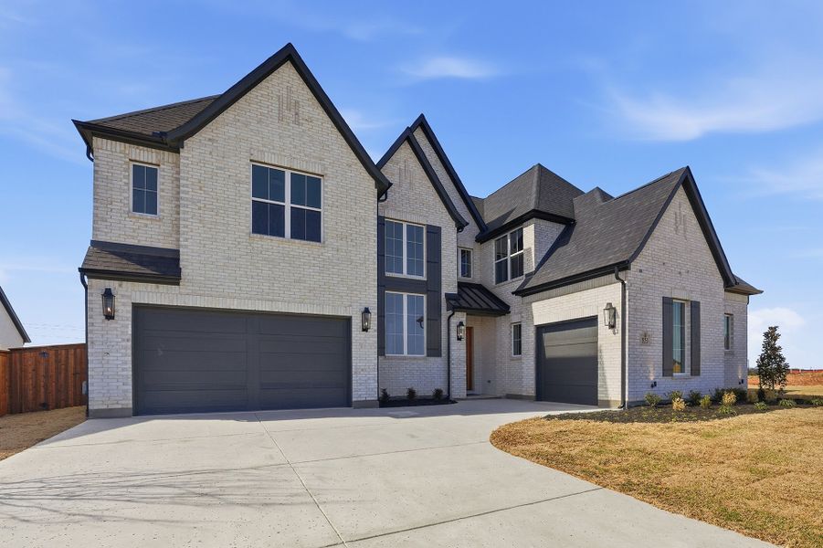 Front exterior of a new home in Park Place - 80' Lots, Prosper, TX, highlighting curb appeal (Image 1). Front exterior of a new home in Park Place - 80' Lots, Prosper, TX, highlighting curb appeal (Image 1).