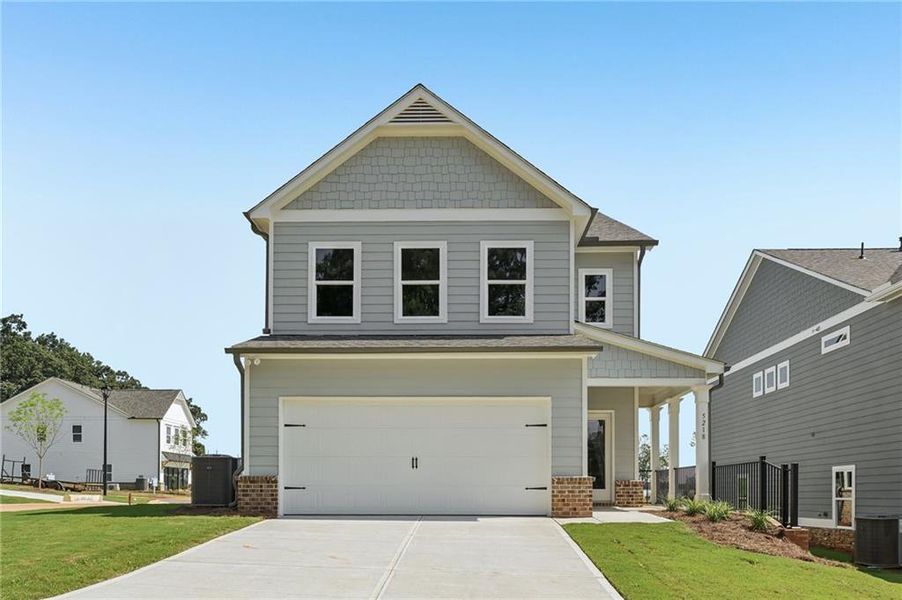 Front exterior of a new home in Magnolia Trace, Flowery Branch, GA, highlighting curb appeal (Image 13).
