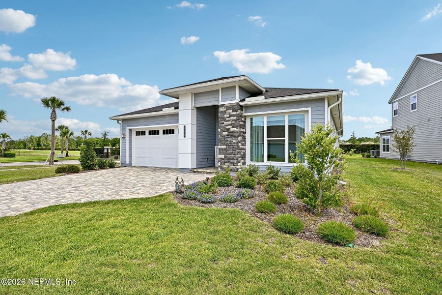 Front exterior of a new home in SilverLeaf, St. Augustine, FL, highlighting curb appeal (Image 29). Front exterior of a new home in SilverLeaf, St. Augustine, FL, highlighting curb appeal (Image 29).