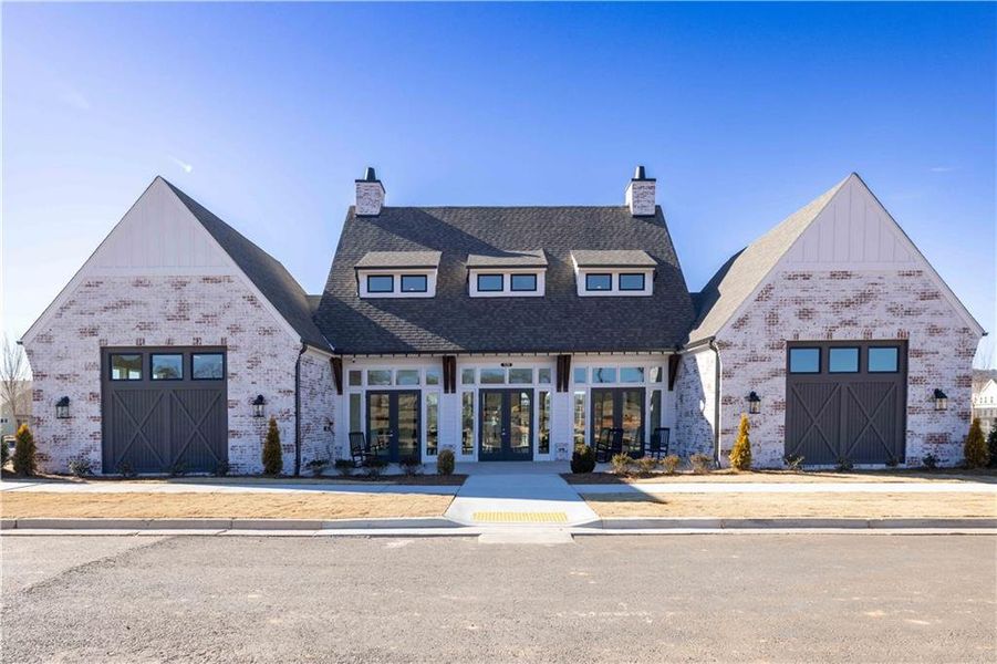 Front exterior of a new home in Promenade at Sawnee Village, Cumming, GA, highlighting curb appeal (Image 27).