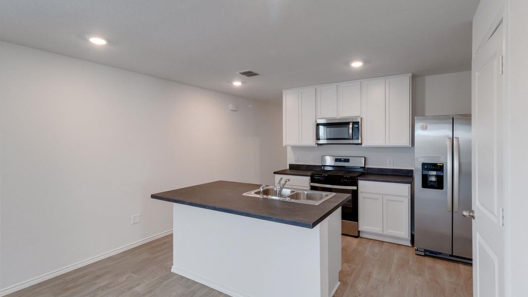Furnished interior view inside a new home in Prairie Lakes, Buda (Image 7).