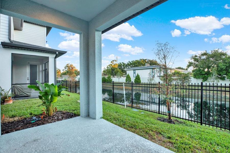 Exterior details and patio area of a home in The Towns At Long Bayou, Seminole (Image 21).