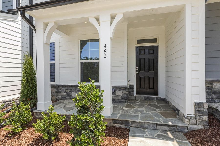 Front exterior of a new home in Enclave at Traditions Townhomes, Wake Forest, NC, highlighting curb appeal (Image 2).