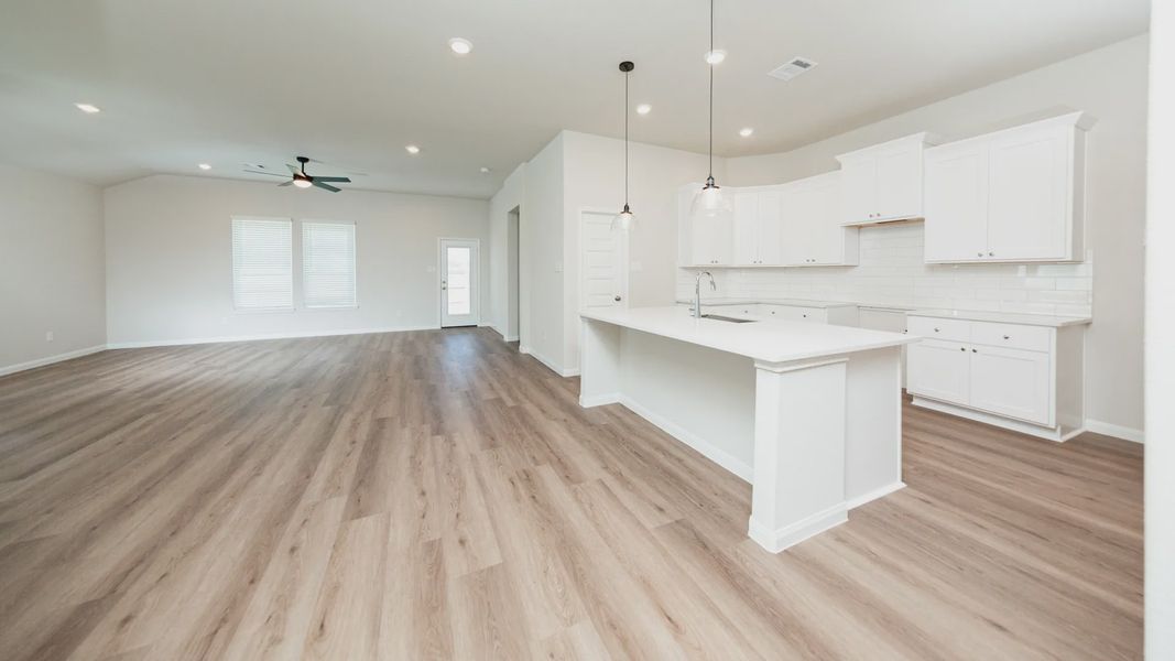 Kitchen and Dining Area to Family Room