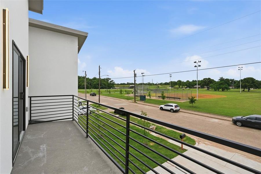 Private balcony with a concrete floor and contemporary horizontal metal railings Private balcony with a concrete floor and contemporary horizontal metal railings
