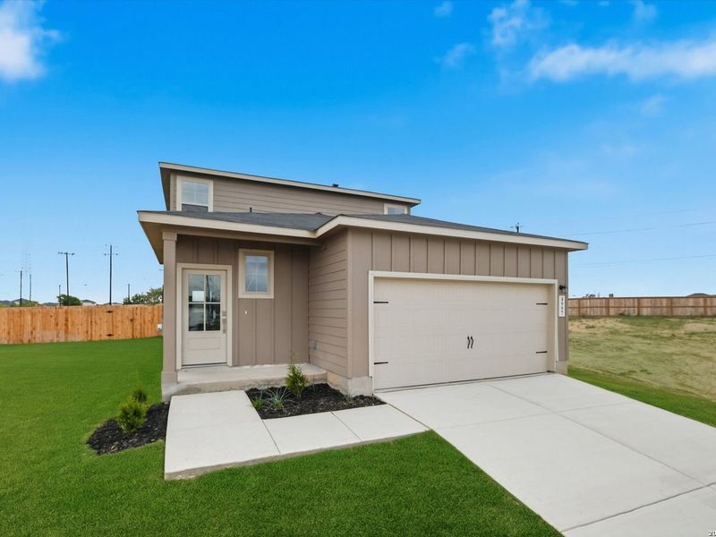 Front exterior of a new home in Agave, San Antonio, TX, highlighting curb appeal (Image 25).