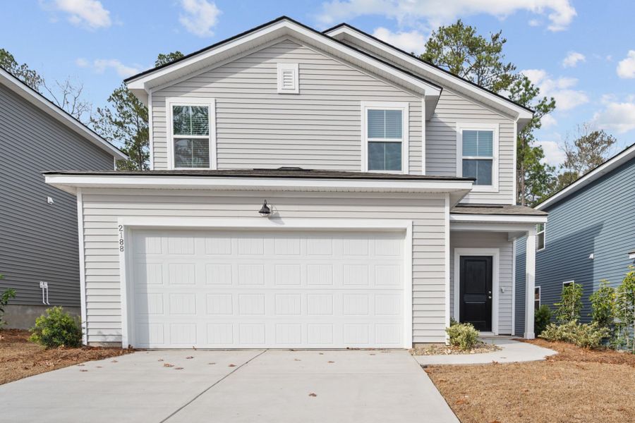 Front exterior of a new home in Grand Arbor, Blythewood, SC, highlighting curb appeal (Image 18).