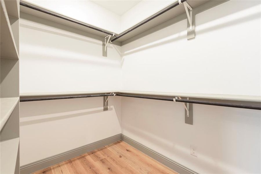 Walk in closet featuring light wood finished floors