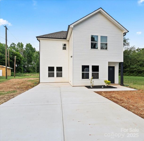 Front exterior of a new home in , Salisbury, NC, highlighting curb appeal (Image 1).