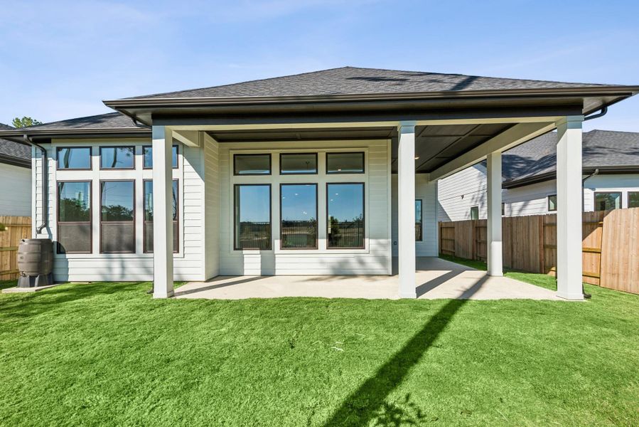 Exterior details and patio area of a home in ARTAVIA 50' Homesites, Conroe (Image 27).