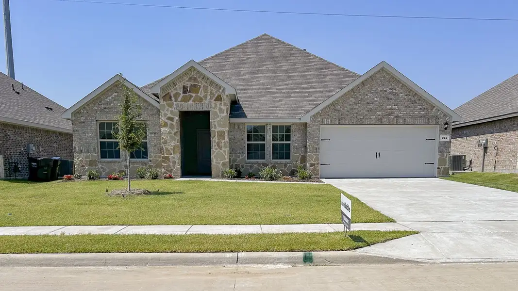 Representative exterior photo of a completed home built from the GARLAND by D.R. Horton in Northspur, Forney, TX (Image 1).