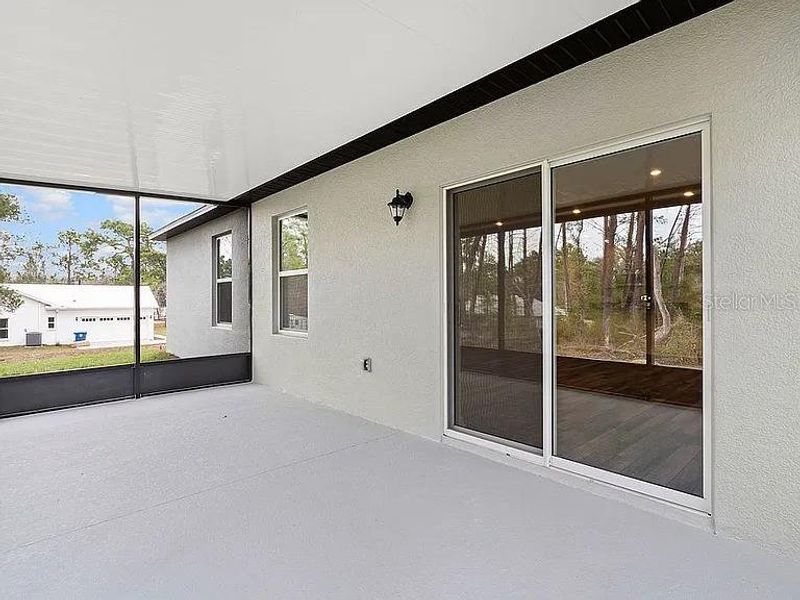 Exterior details and patio area of a home in Royal Highlands, Brooksville (Image 23).