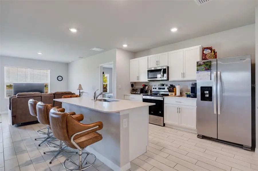 Furnished interior view inside a new home in Coral Bay - Express & Tradition, North Fort Myers (Image 15).