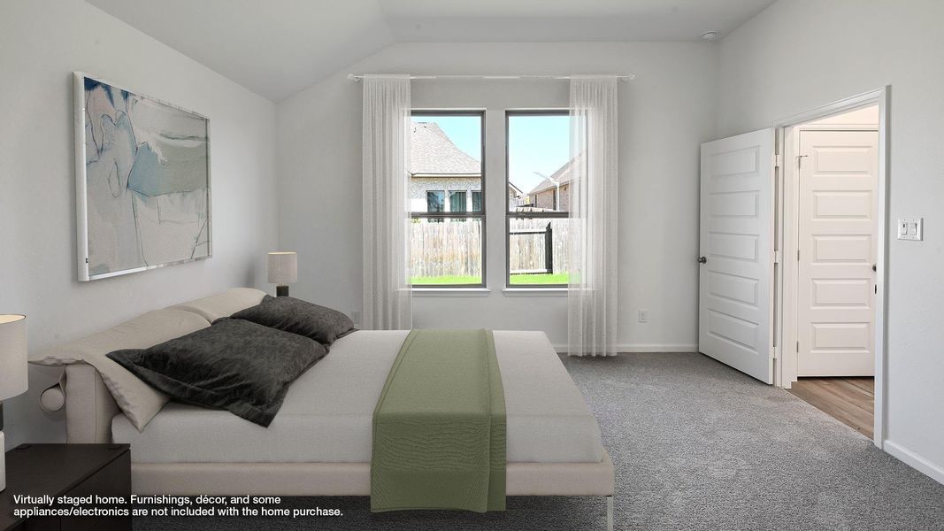 Bedroom with carpet flooring and lofted ceiling Bedroom with carpet flooring and lofted ceiling